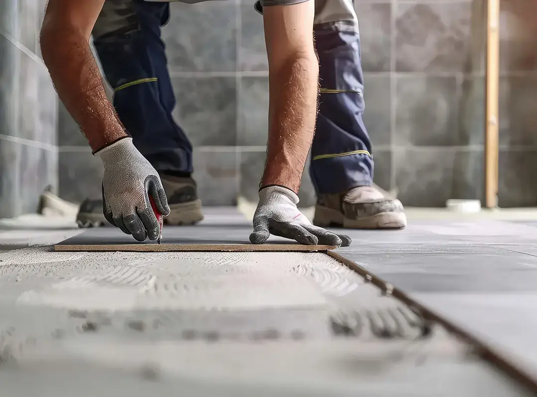 tradesperson tiling floor